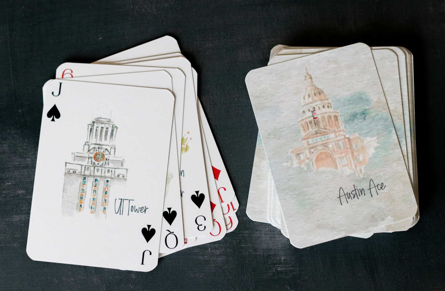 Austin-themed playing card deck featuring watercolor illustrations of city landmarks and culture including South Congress Bridge, Barton Springs, and Keep Austin Weird