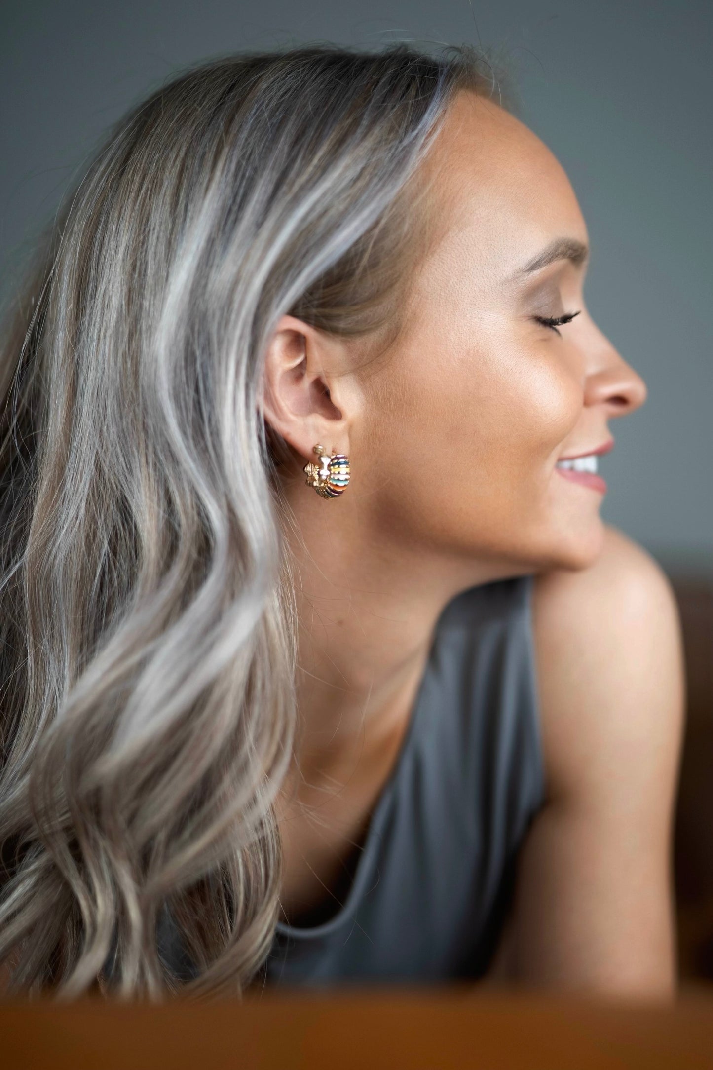 18K gold-plated huggie hoop earrings with colorful enamel stripes in purple, coral, turquoise, pink, and yellow