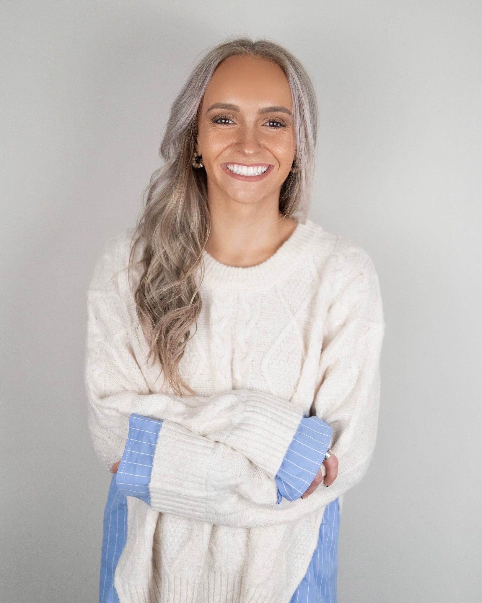 Blake Pullover - oversized cream cable-knit sweater with blue and white pinstripe shirting details at hem and cuffs, crew neckline, and long sleeves