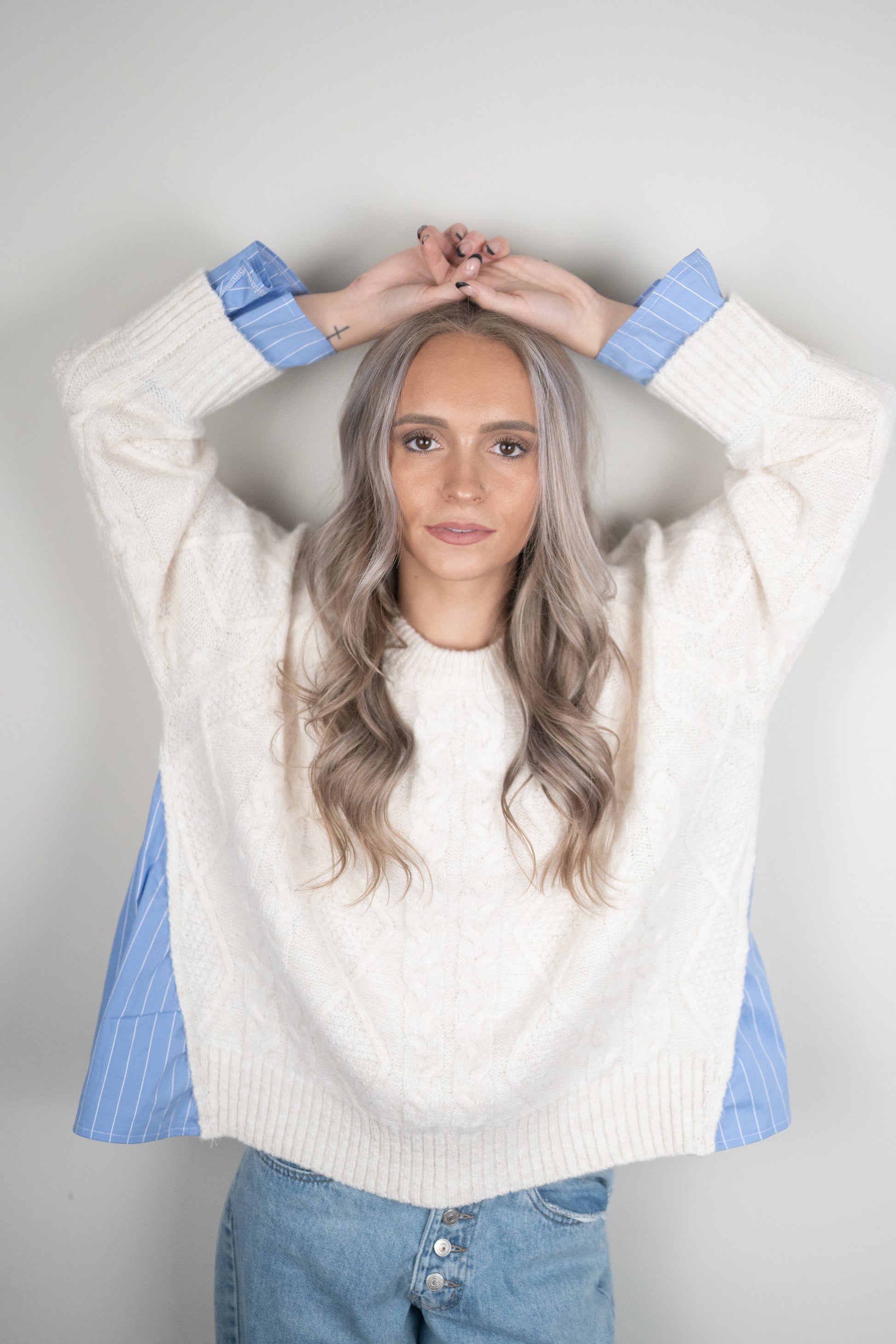 Blake Pullover - oversized cream cable-knit sweater with blue and white pinstripe shirting details at hem and cuffs, crew neckline, and long sleeves