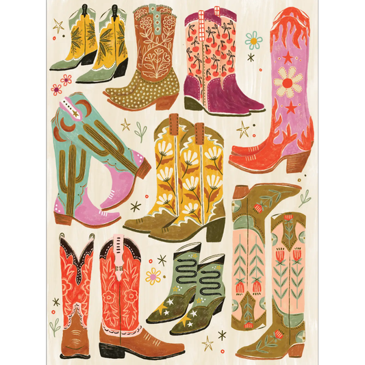 Boot Scootin' Boogie 1,000-piece jigsaw puzzle featuring colorful cowboy boots with vibrant patterns including florals, cacti, daisies, and flames